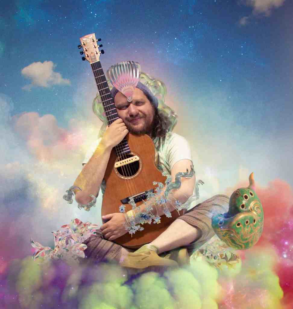 BenBen musical artist photo hugging a guitar