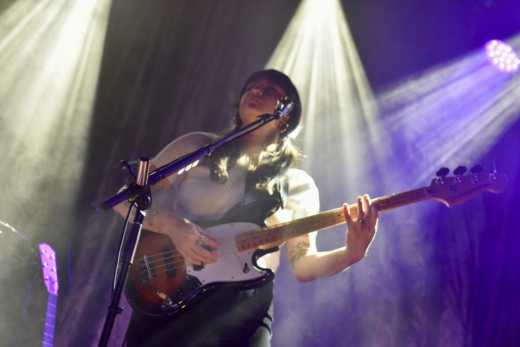 Bass guitar player performing with Lauren Mayberry in Nashville