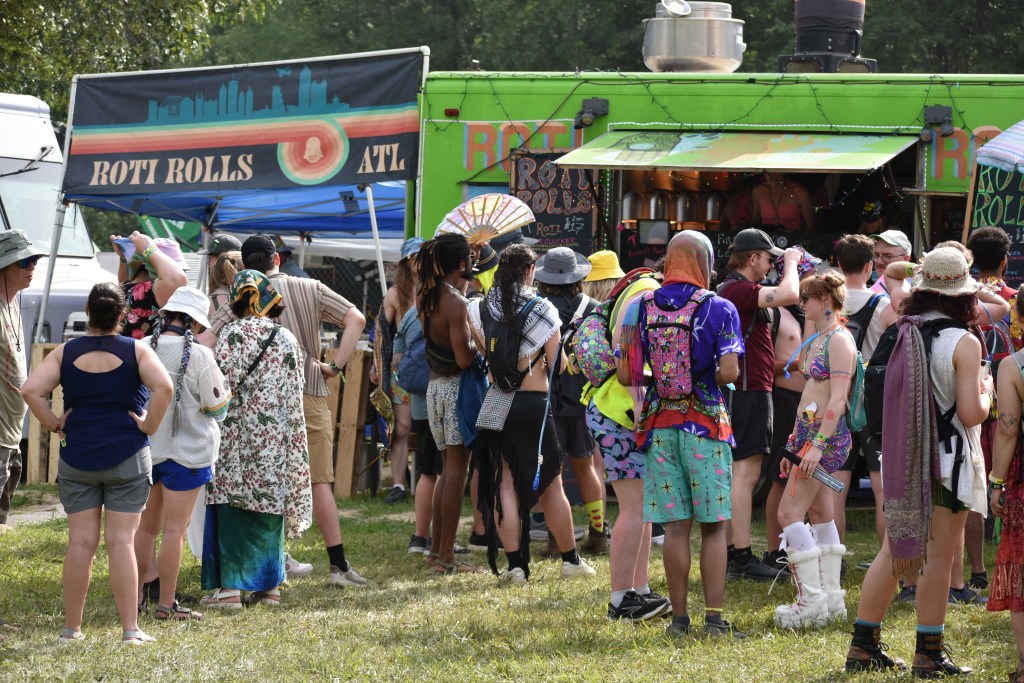 People lining up for Roti Rolls at Bonnaroo 2025
