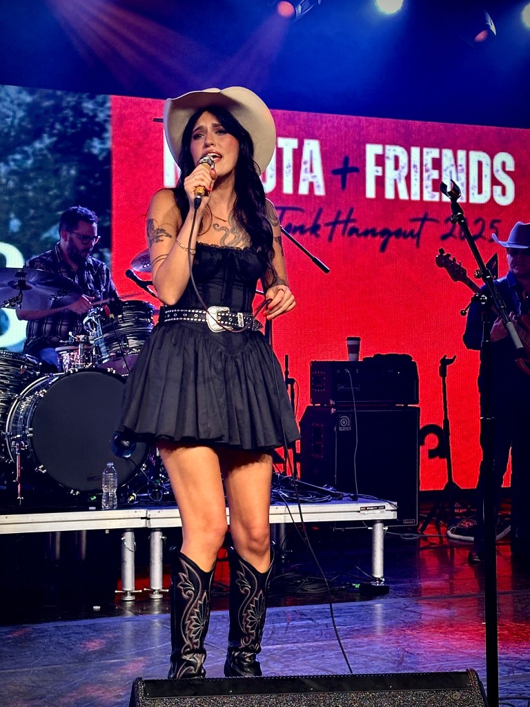 Gowa Gibbs singing with at Cannery Hall at Kubota Tractors event at CMA Fest 2025