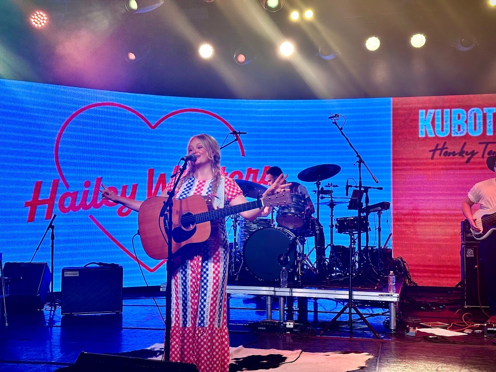 Hailey Whitters singing in Nashville at Cannery Hall for Kubota Tractors CMA event