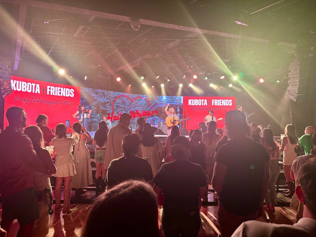 Hailey Whitters photo from crowd at Cannery Hall in Nashville for Kubota Tractors event at CMAFest 2025