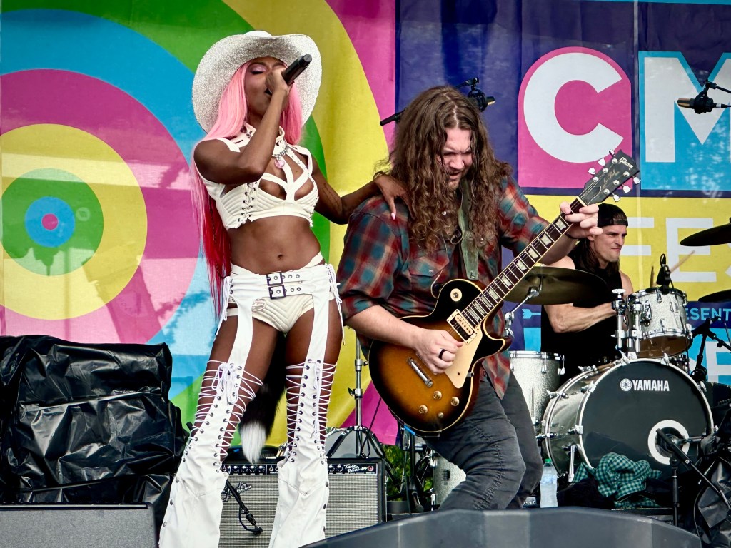 Reyna Roberts with guitarist performing in Nashville at CMA Fest 2025