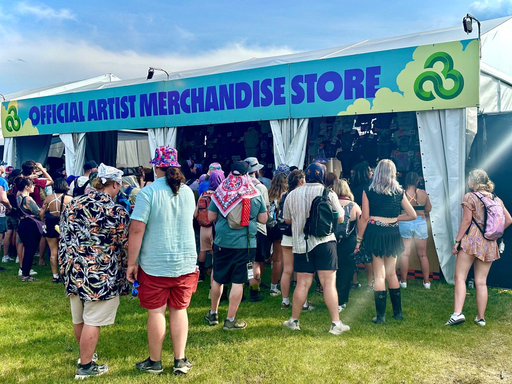 Fans wait in line to get their favorite artist's merch on Thursday at Bonnaroo 2025