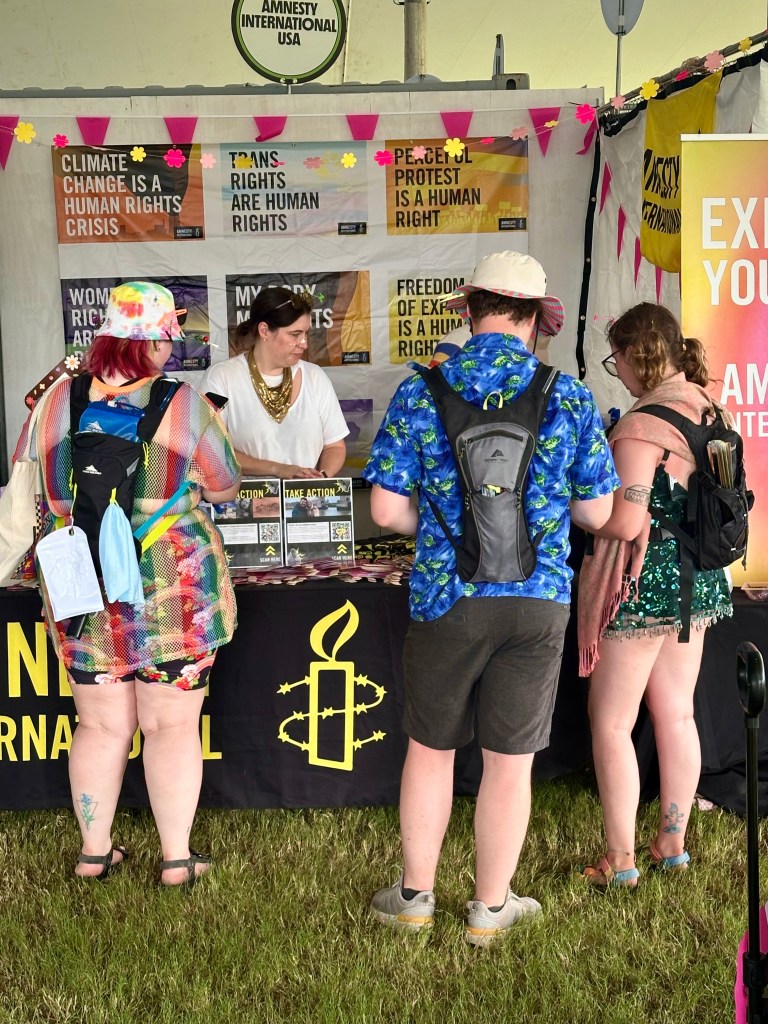 Non-profit Amnesty International doing outreach at the 2025 Bonnaroo music festival