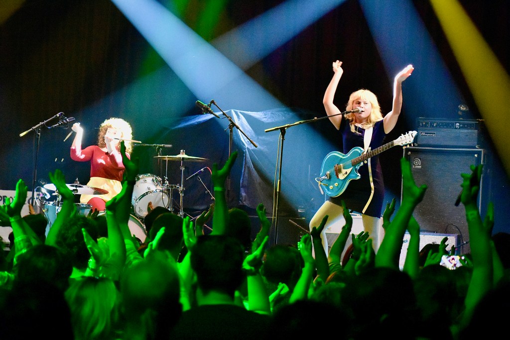 Girl Tones band playing at Nashville's Brooklyn Bowl with crowd clapping along in foreground