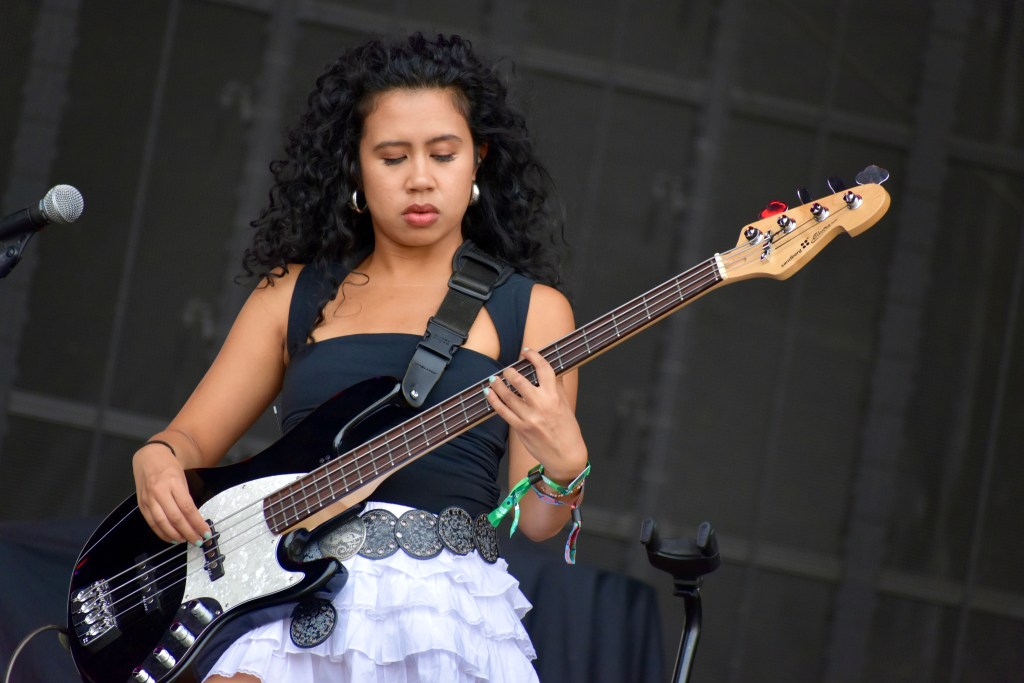 Bass player performing with Gigi Perez at Hinterland Music Festival 2025 in Saint Charles Iowa
