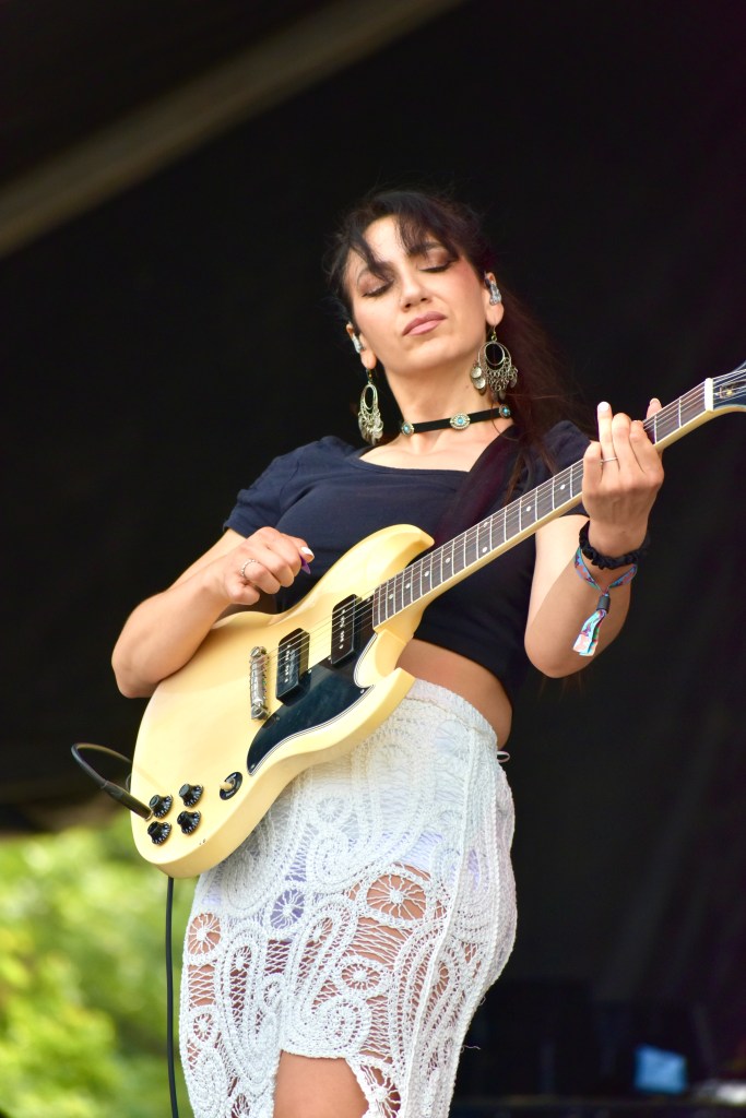 Guitarist performing with Gigi Perez at Hinterland Music Festival 2025 in Saint Charles Iowa