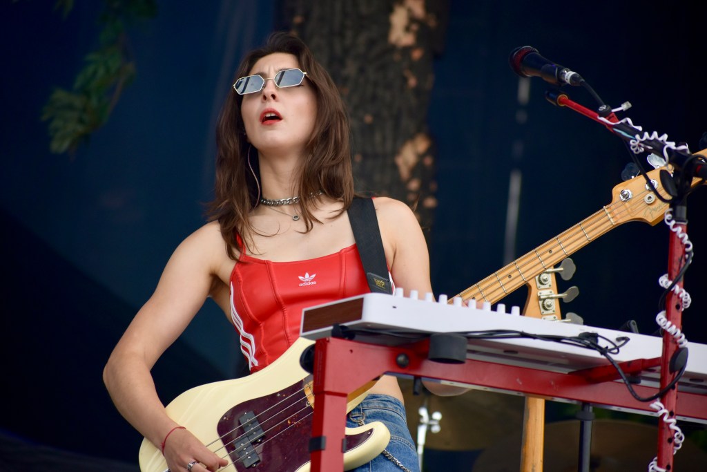 Scarlet Halton playing guitar with Orla Gartland at Hinterland Music Festival 2025