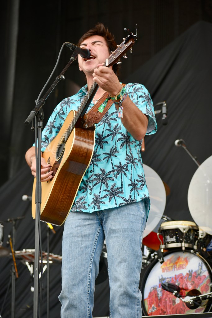 Wyatt Flores playing guitar at Hinterland Music Festival