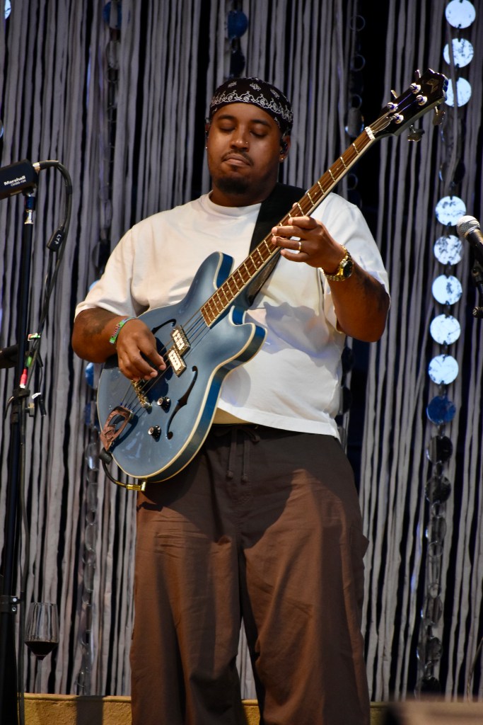 Bass player performing with Clairo at Hinterland 2025