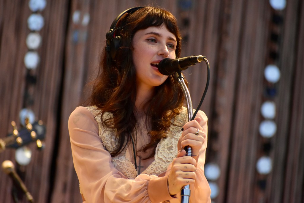 Clairo singing at the 2025 Hinterland Music Festival