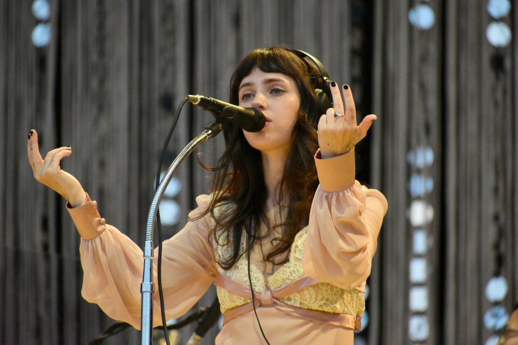 Clairo singing at the 2025 Hinterland Music Festival