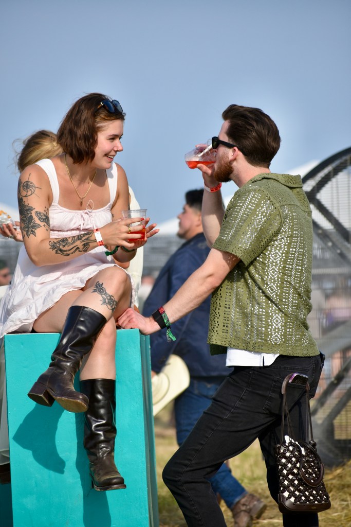 Two music fans enjoying drinks between sets at Hinterland Music Festival