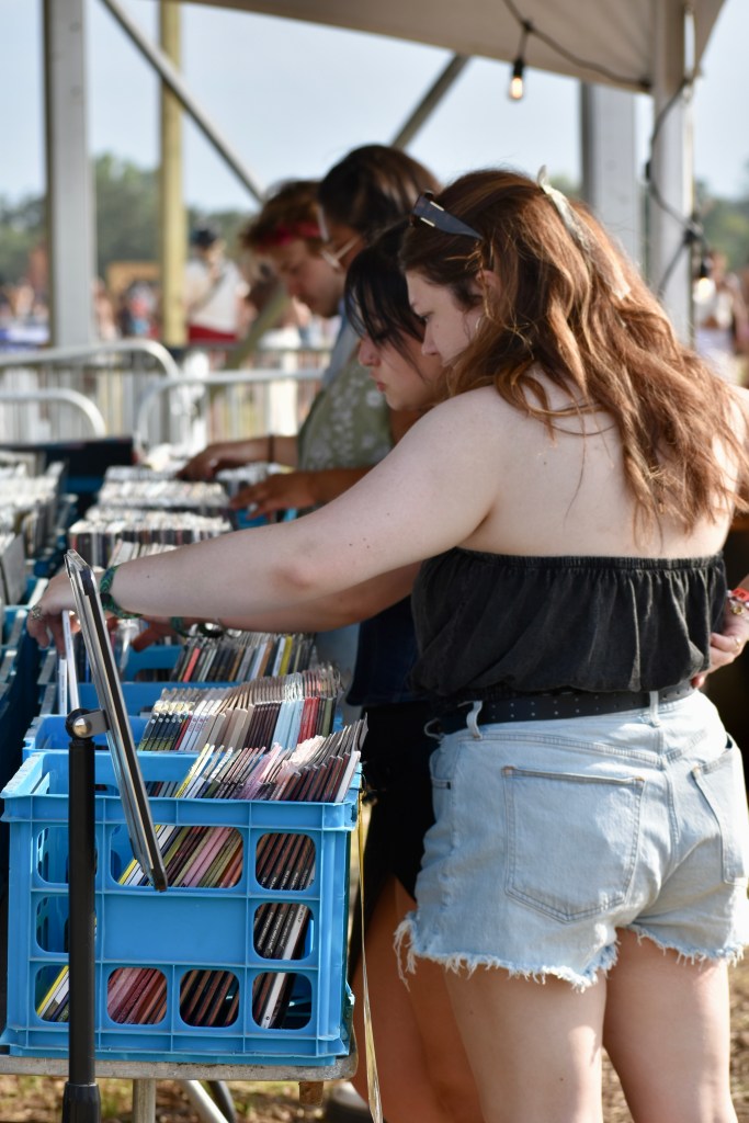 Music fan Hinterland Music Festival 2025 looking at records for sale by Vinyl Cup Records