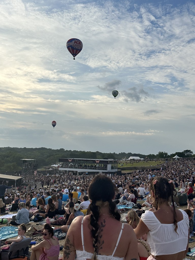 Music fans watch as hot air balloons travel over Hinterland Music Festival 2025