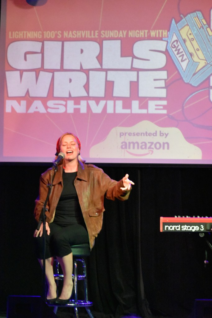 Ashe performing at the 2026 Girls Write Nashville Benefit Concert