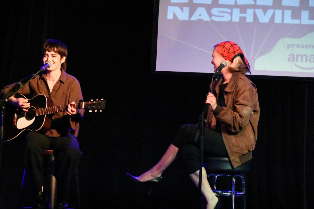 Ashe with guitarist Emma Harvey performing at the Girls Write Nashville 2026 Benefit Concert