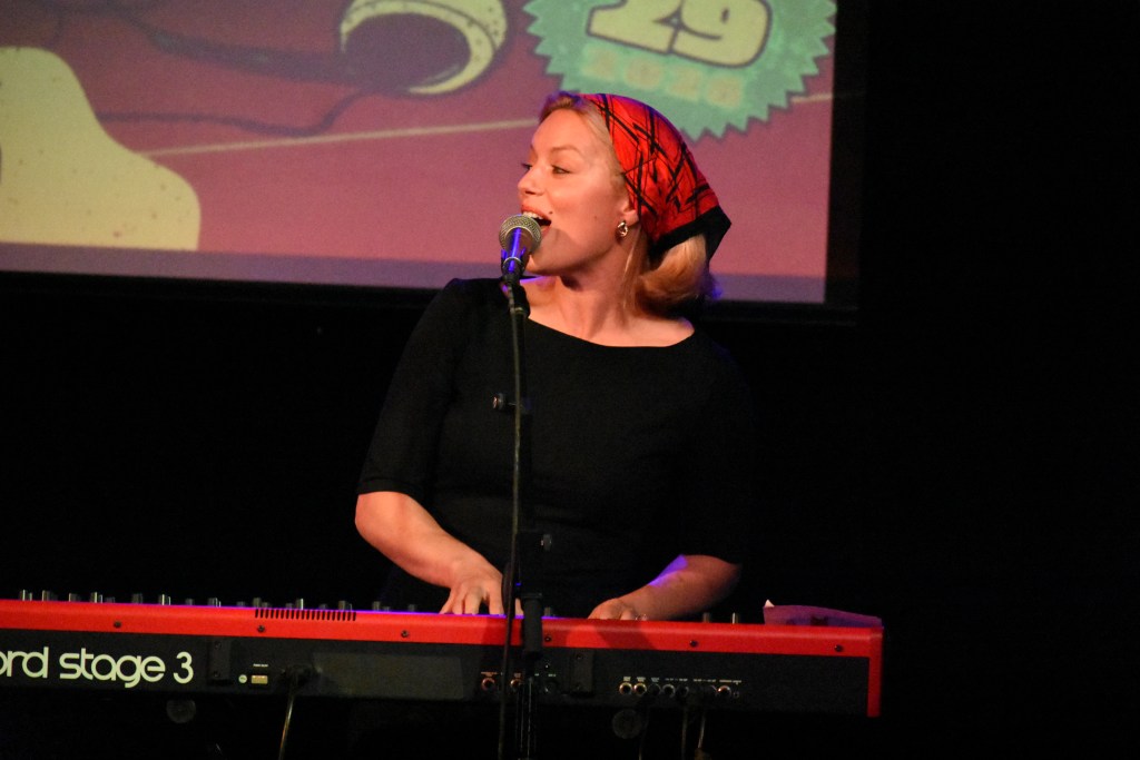 Ashe playing a keyboard and singing at 3rd and Lindsley in Nashville Tennessee