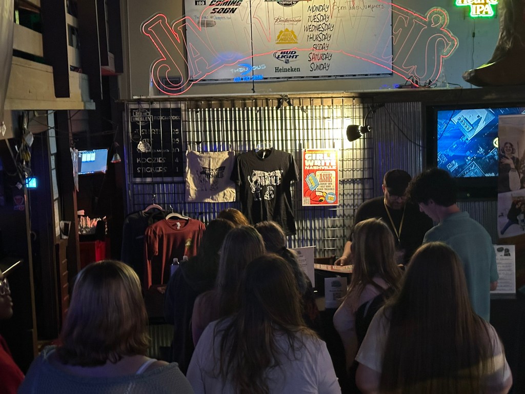 Merchandise on display at the Girls Write Nashville Benefit Concert 2026