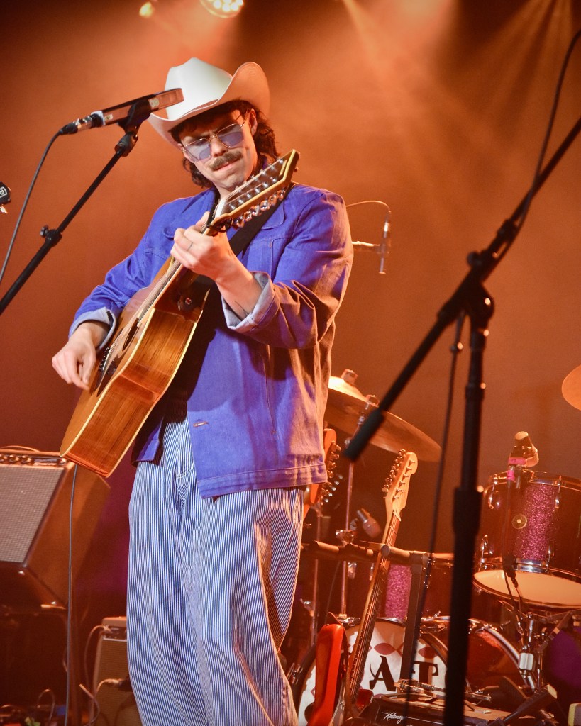 Boy Golden playing guitar at the Row One Stage at Cannery Hall in Nashville