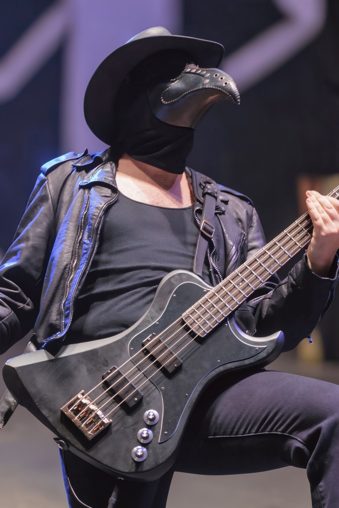 Bass player of Castle Rat performing while the band performs in Nashville Tennessee