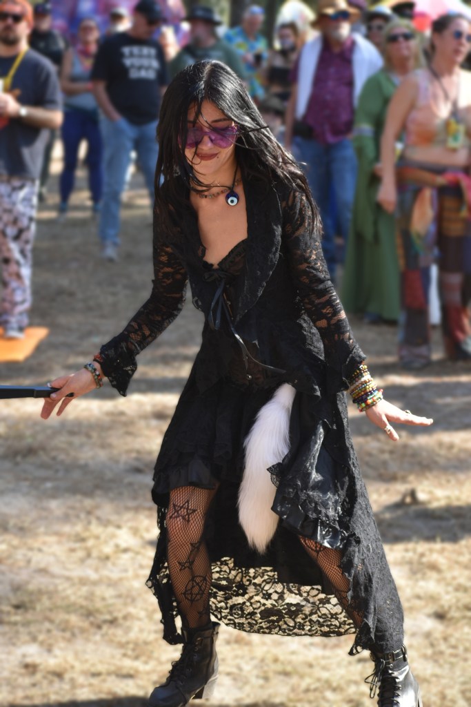 A fan dances at Tire Fire performing at Hulaween 2026