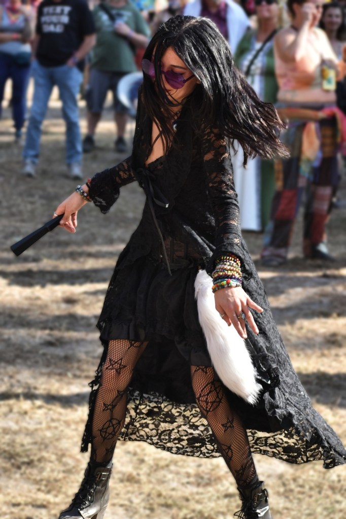 A fan dances at Tire Fire performing at Hulaween 2026