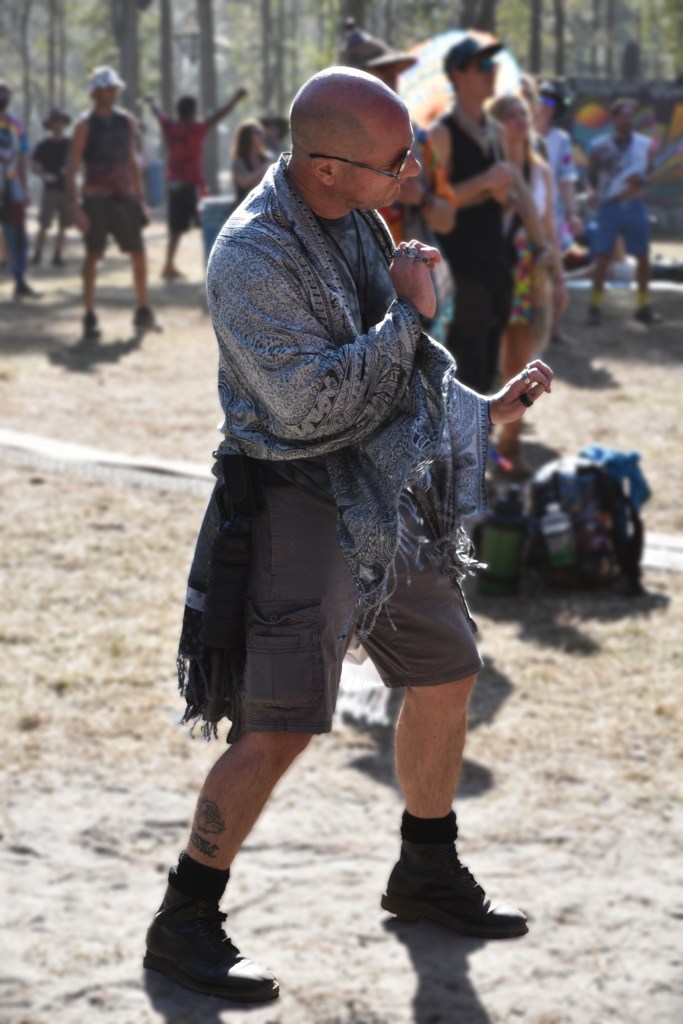 A fan dances at Tire Fire performing at Hulaween 2026